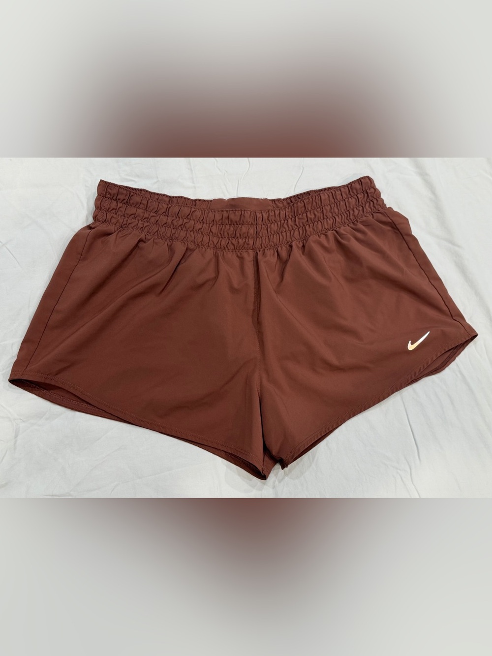 womens nike one dri-fit brief lined shorts - paint mark on rear